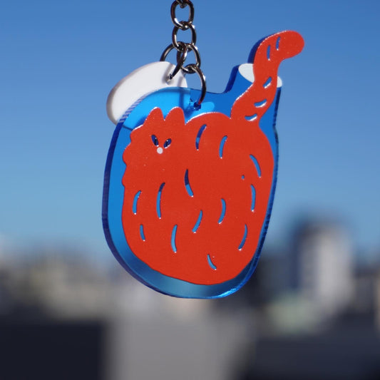 Keychain | Cat in the blue bottle.